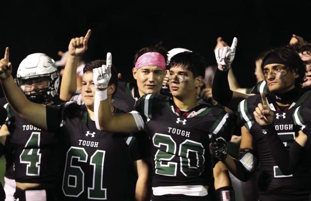 Following an emotional ‘Senior Night’victory over the Brownsboro Bears Oct. 20, the Canton Eagles listened to the playing of the school song. Among those standing at attention were Logan Faglie (4), Mike Vasquez (61), Collin Campuzano (20), and Noe Mendieta (7). The Eagles will enjoy an open date before traveling to Rusk for their final regular season game Nov. 3. Photo by Lianna Reid